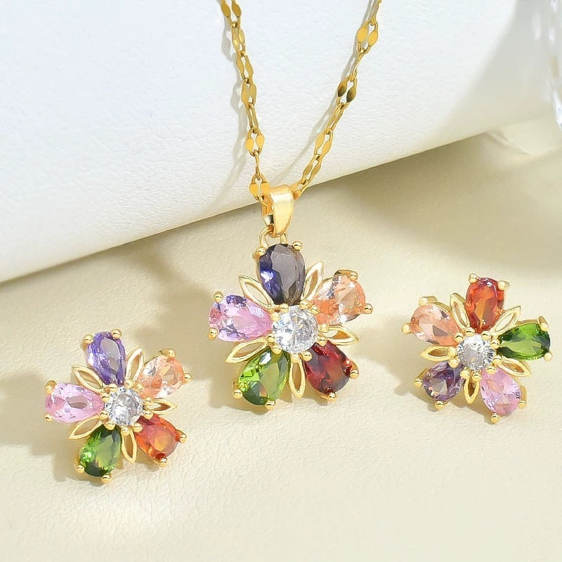 Joyería de flor de cinco pétalos con cristales dorados de colores