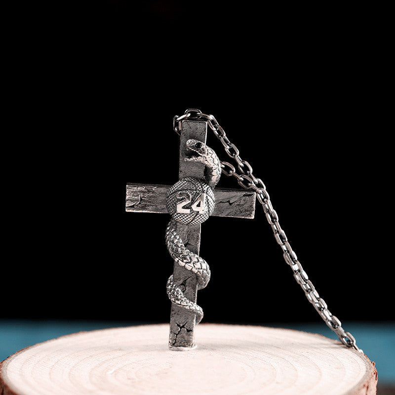 Collar de cruz y serpiente de plata