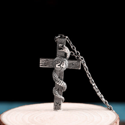 Collar de cruz y serpiente de plata